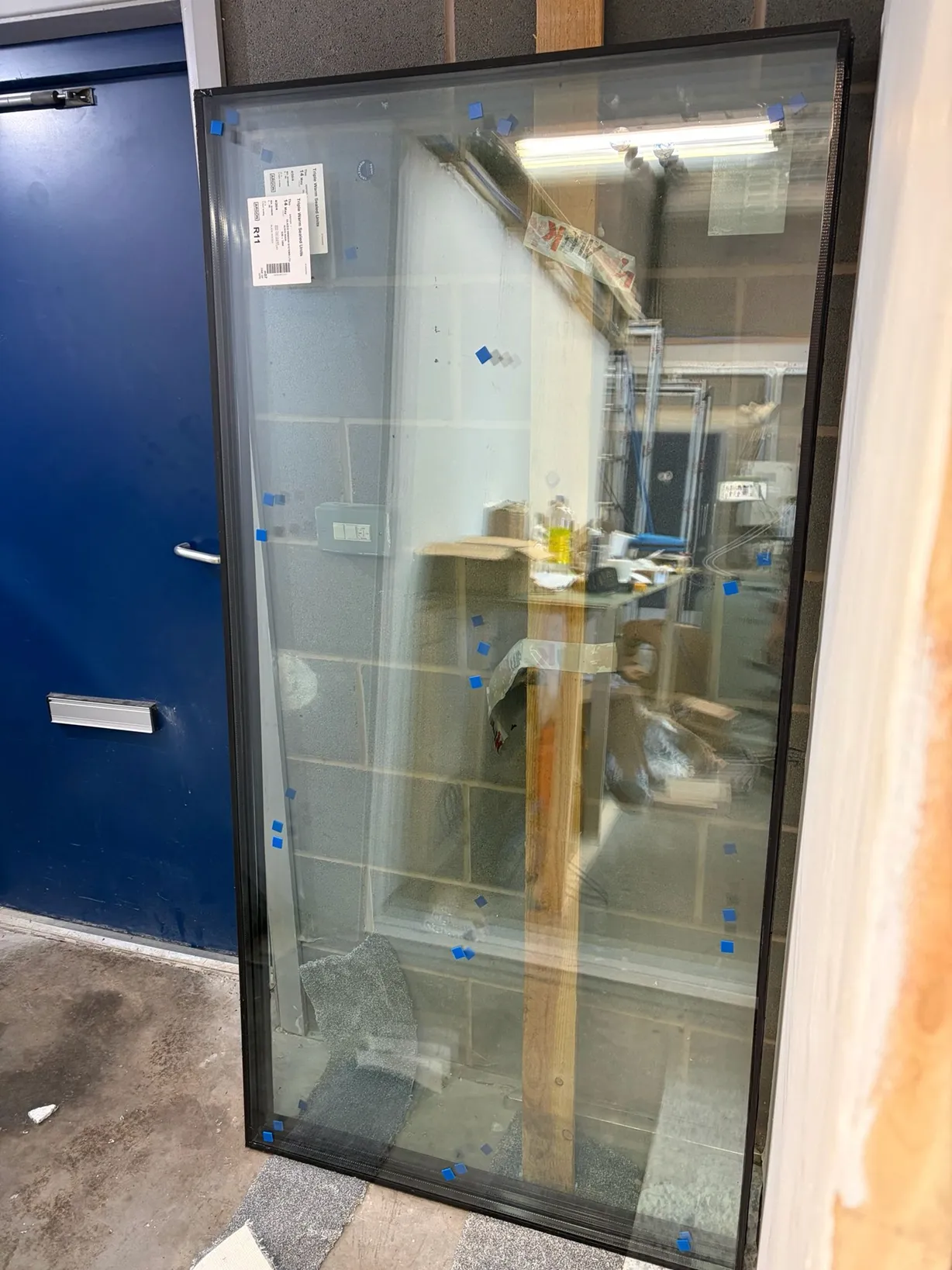 Aluminium bifold door frame assembly at the Glazed Windows Ltd Birmingham workshop